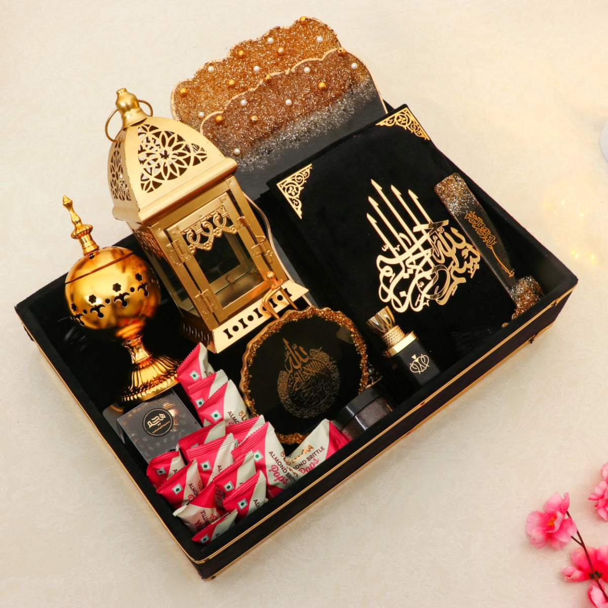 Premium Ramadan Kareem Hamper Gifts with black velvet Quran, bakhoor burner, ittar, and sweets, ideal for gifting during Ramadan.