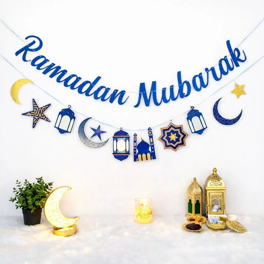 Ramadan Mubarak banner with lanterns and crescent moon decor