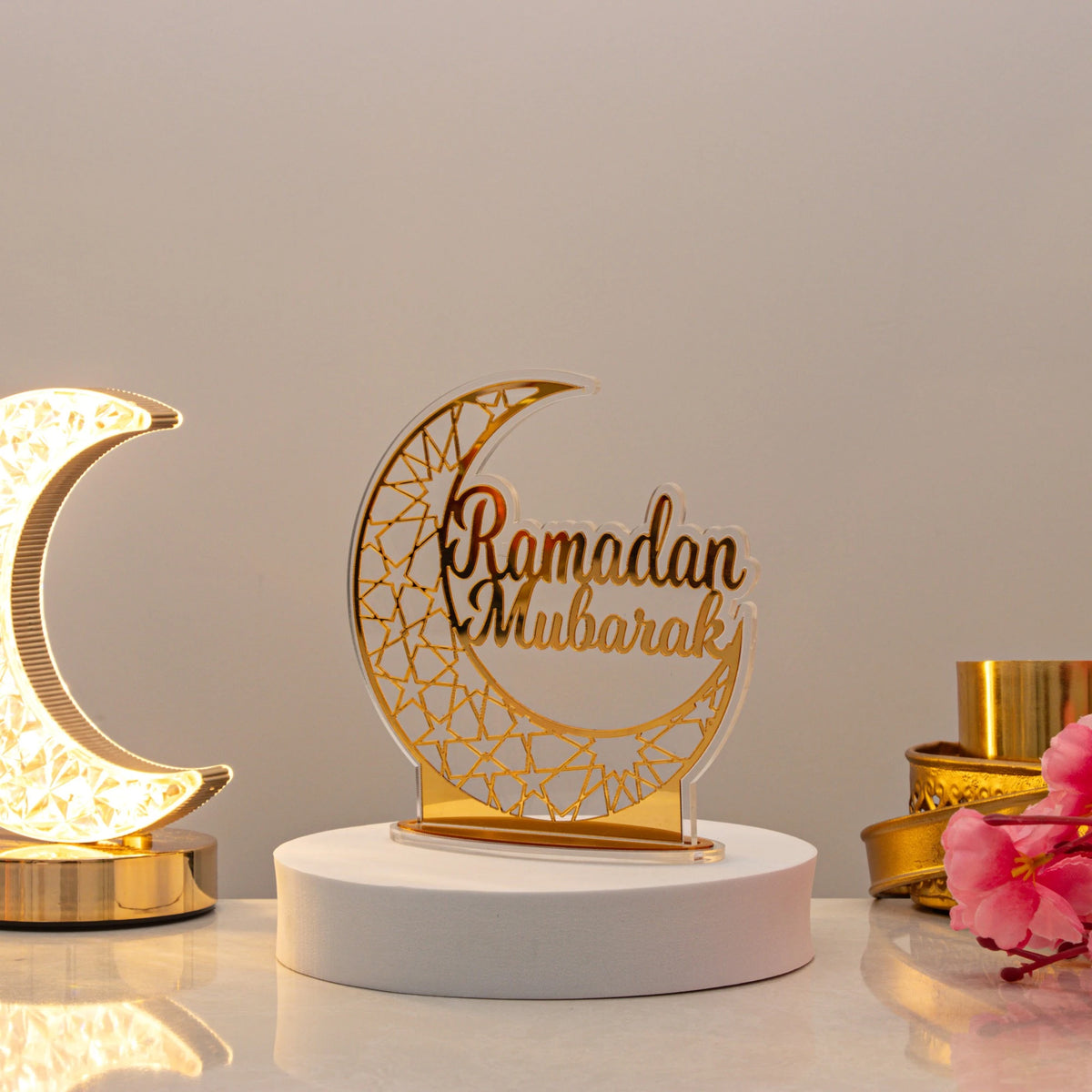 Elegant Ramadan Mubarak Stand centerpiece on display table, surrounded by festive decor. Adds charm to Ramadan celebrations with easy setup.