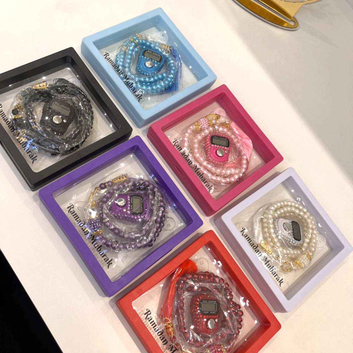 Assorted Ramadan Mubarak Tasbeeh Combos in various colors with digital counters and beads. Perfect for gifting during Ramadan.