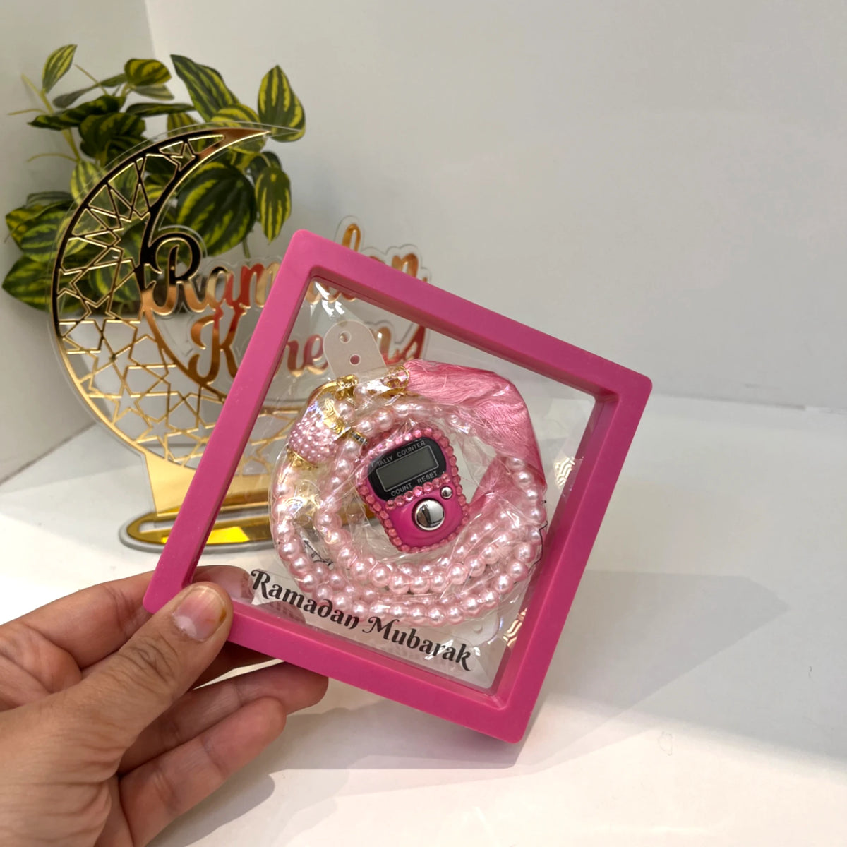 Pink Ramadan Mubarak Tasbeeh Combo with digital counter and pearl beads in gift box. Ideal spiritual gift for Ramadan devotion.