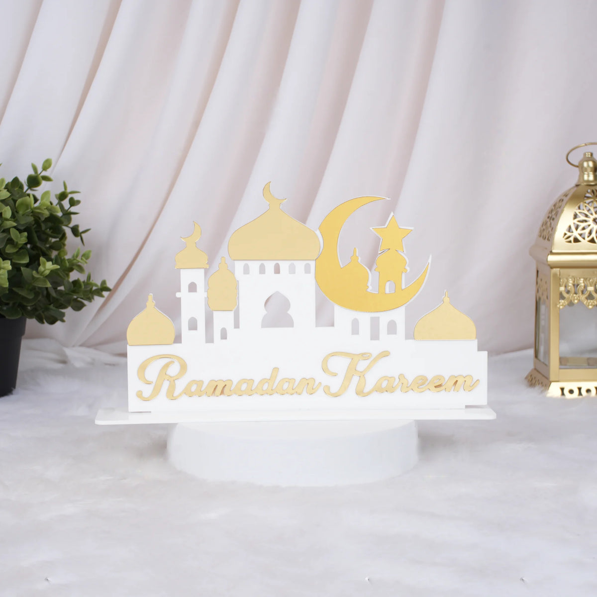 Ramadan Kareem mosque silhouette stand with gold accents