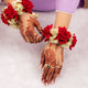 Bridal Handcrafted Red Floral Gajra featuring red roses and white flowers, perfect for Haldi, Mehndi, or Nikah wedding ceremony gifts and decor.