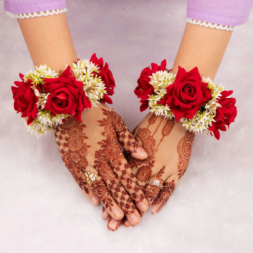 Handcrafted Red Floral Gajra with red roses and white buds worn on wrists, ideal for bridal accessories and wedding favors in traditional ceremonies. Main image