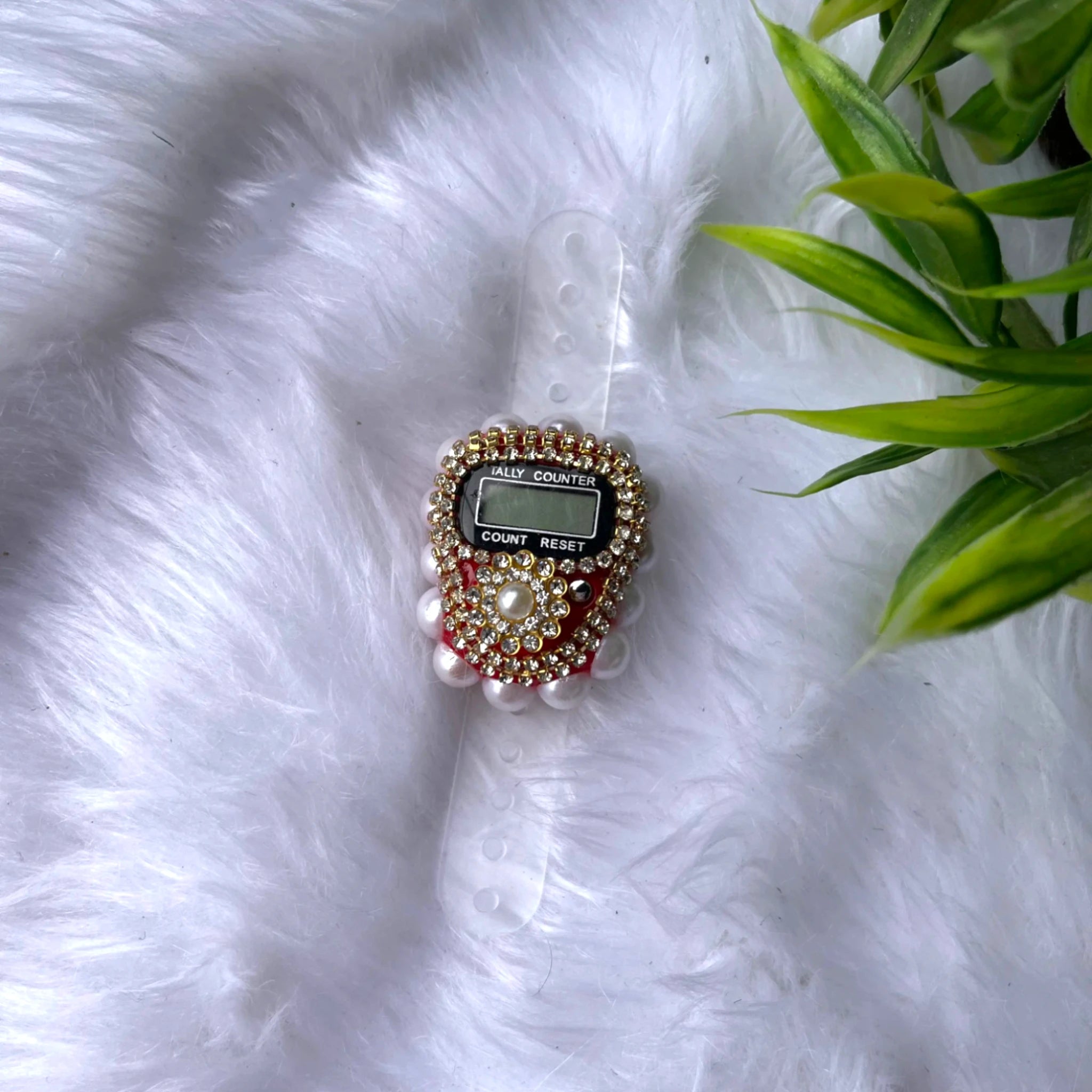 Red Pearl Digital Tasbeeh adorned with pearls and crystals, featuring a digital counter for efficient prayer counting.