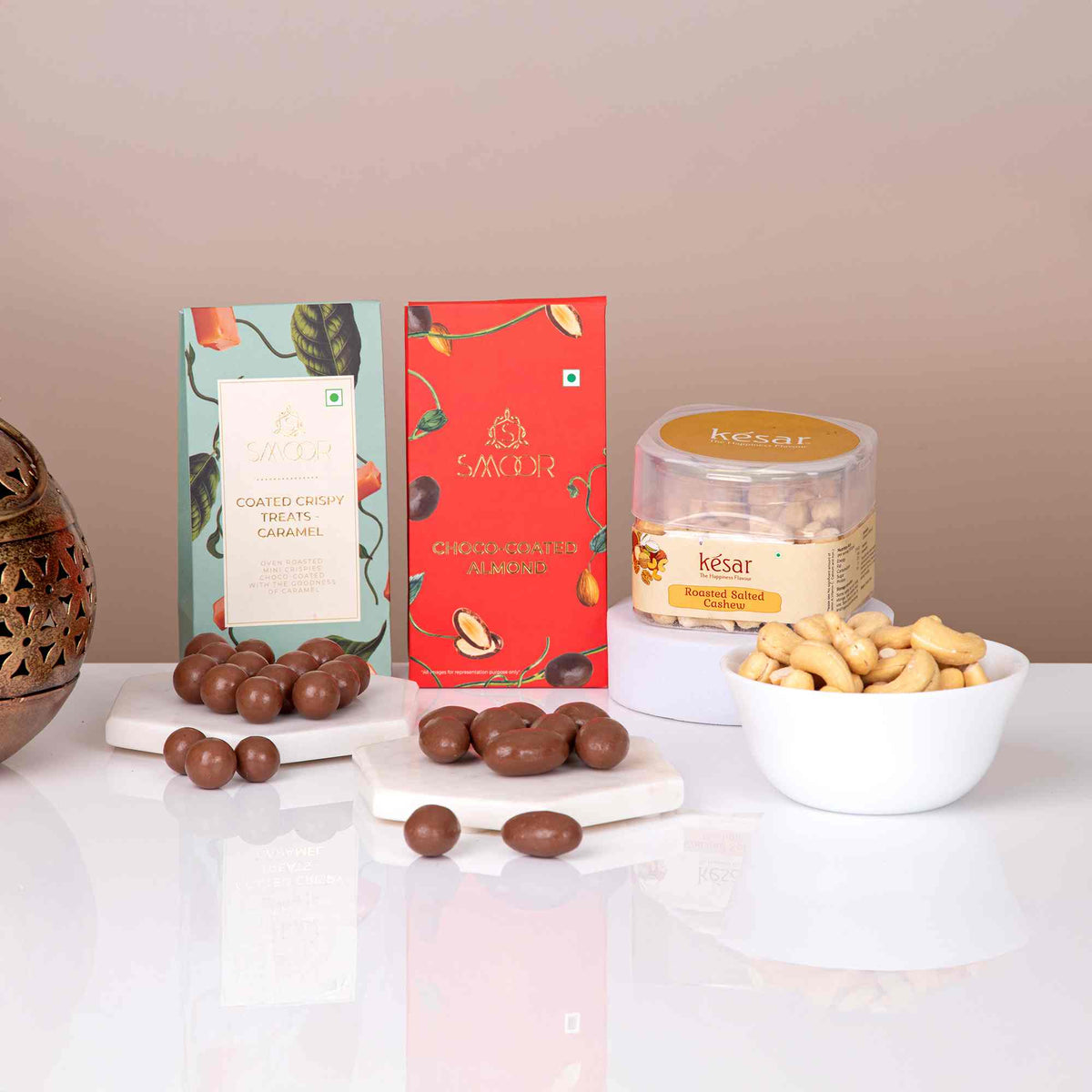 Close-up of Red Velvet Blessings Hamper contents including caramel treats, choco-almonds, and roasted cashews for festive gifting.