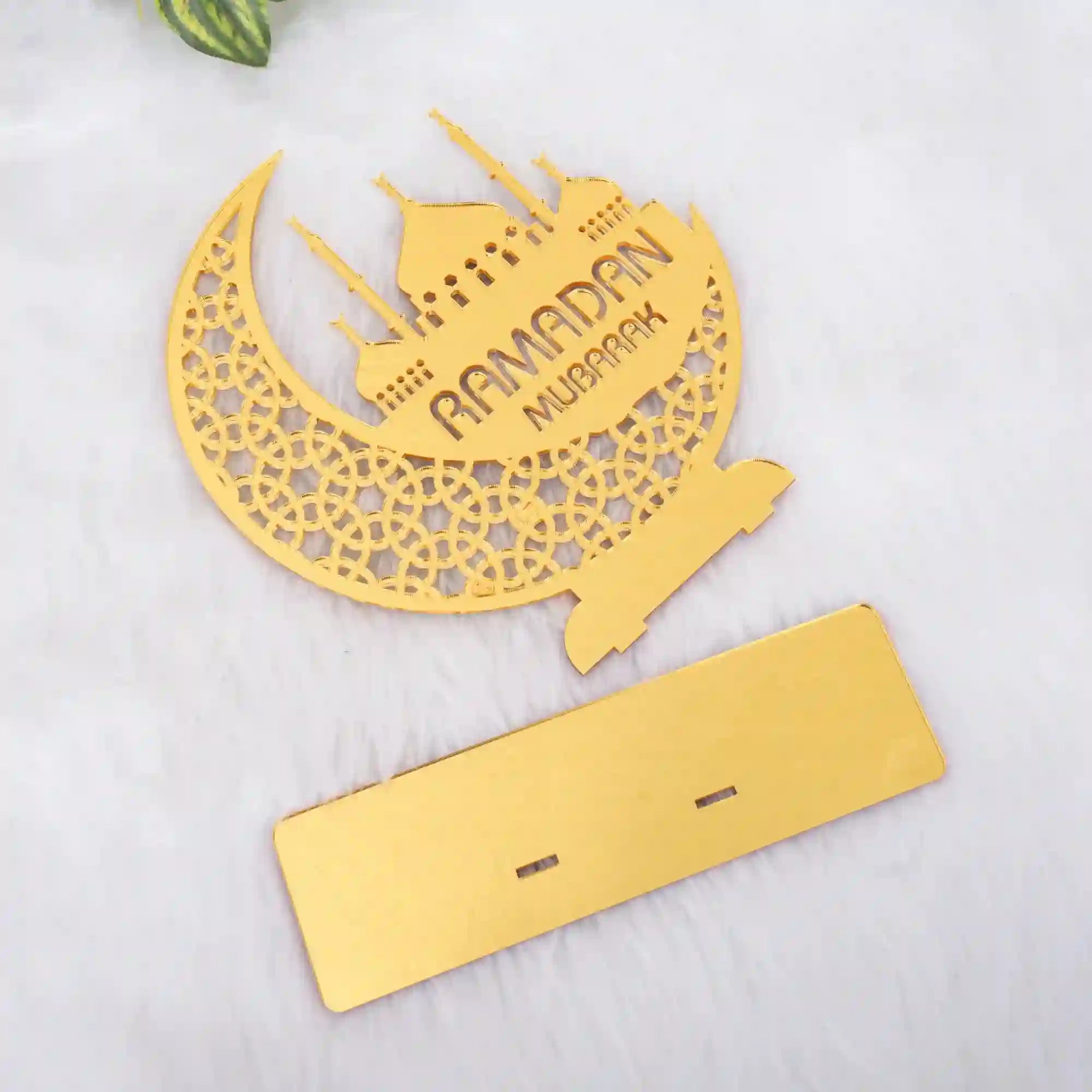 Disassembled Ramadan Mubarak Stand showing gold crescent-mosque panel and base, highlighting easy setup and durable festive home decor.