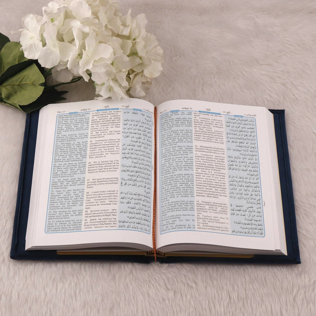 Open Quran with bilingual Arabic-English translation from Blue Stones Rehal Hamper. Great for learning and understanding the Quran.