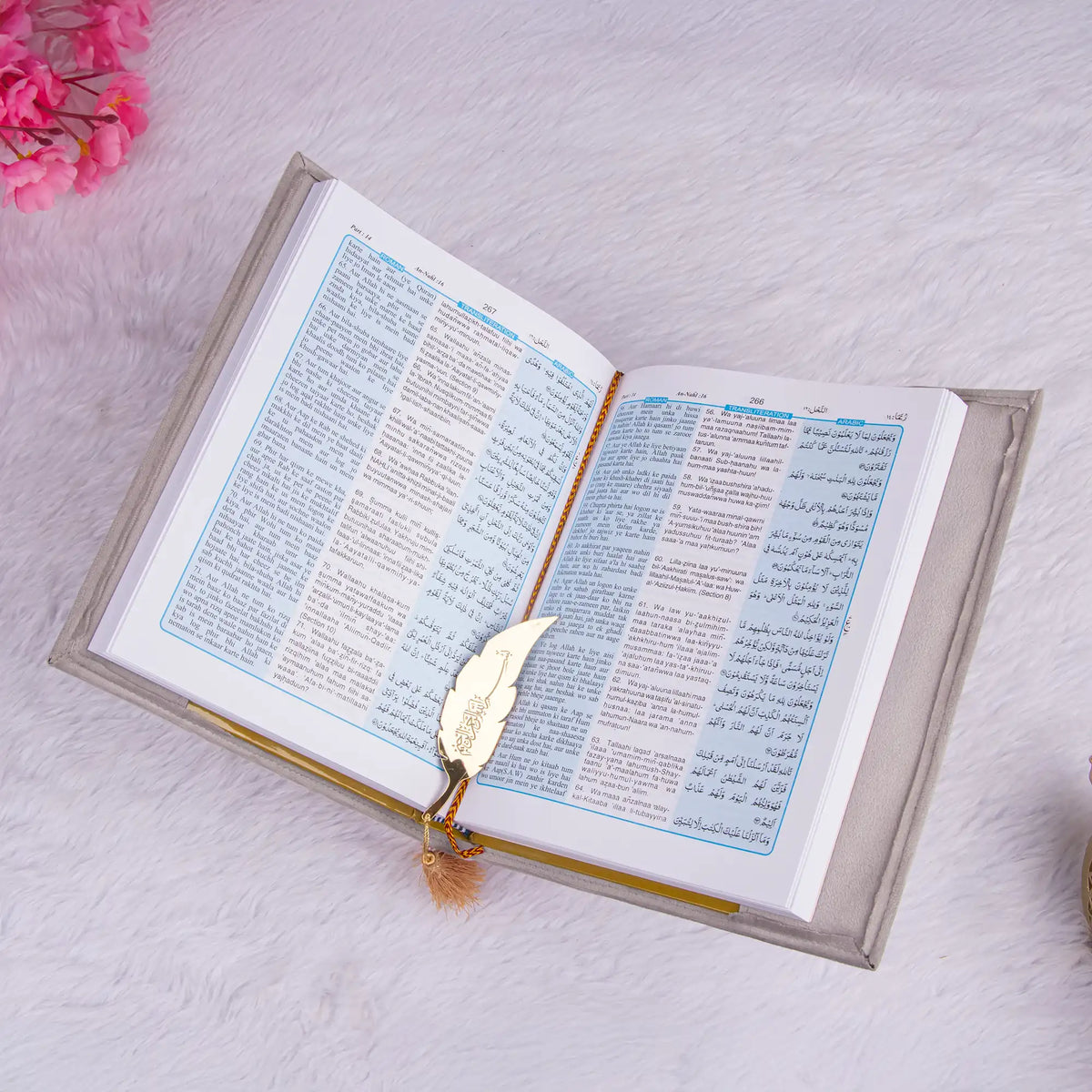 Open Quran with Urdu translation and golden feather bookmark from the Silver Sawab-e-Jariya Gift Set. Ideal for gifting and study.
