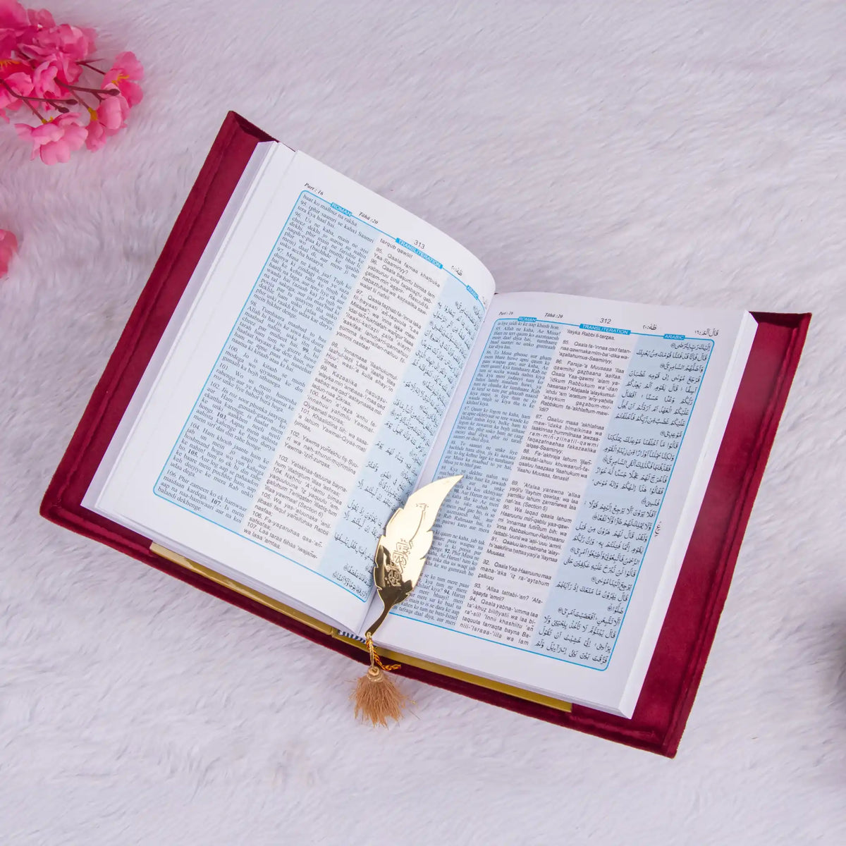 Open book with a decorative bookmark on a light background
