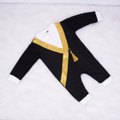 Flat lay of Bisht Romper for Baby Boys featuring black fabric, gold sash detail, and snap-button closure, perfect for newborns and toddlers.