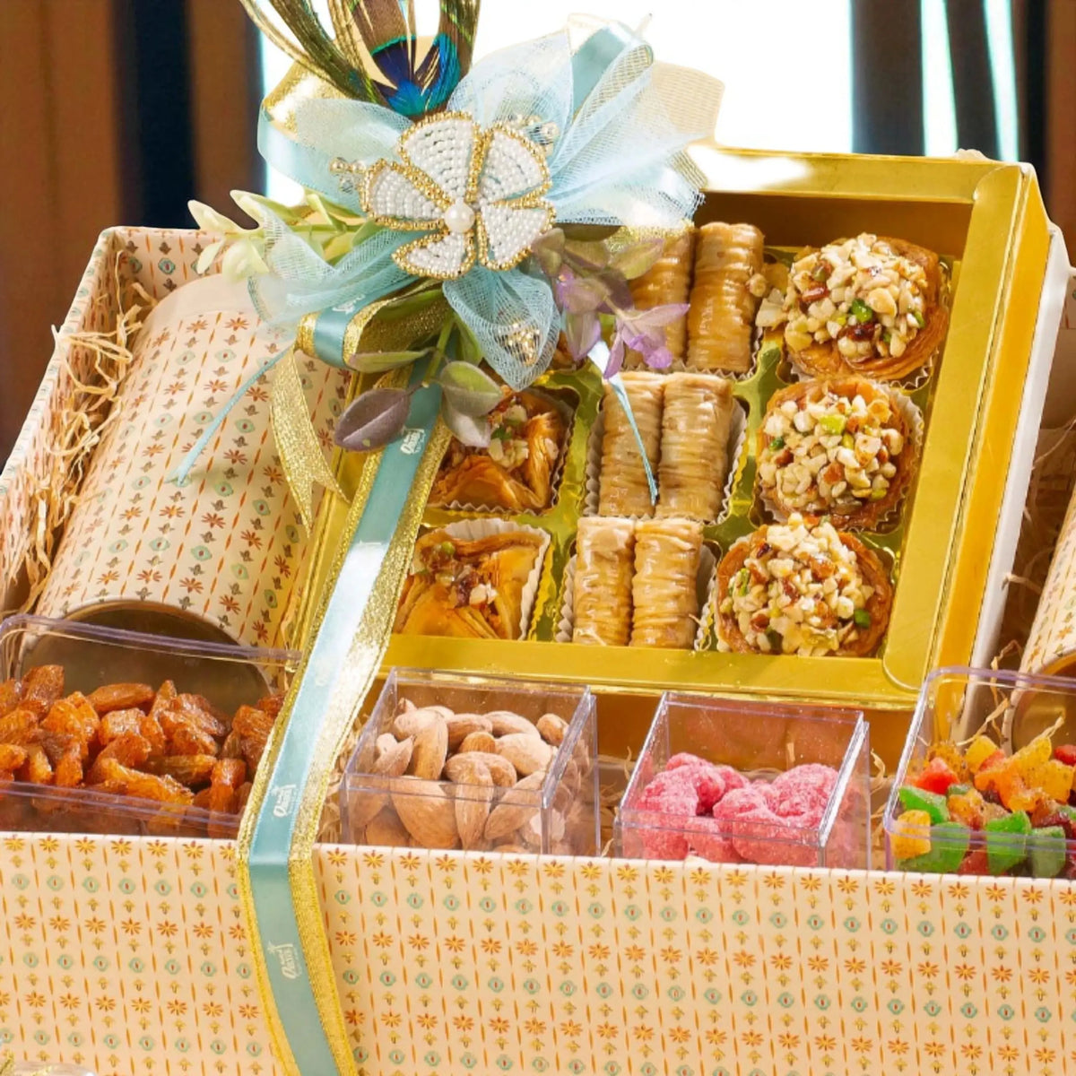 Top view of Sadaqah Sweets Festive Hamper showcasing baklava, nut tarts, and assorted candies in a luxury gourmet gift box for Eid and festive gifting.