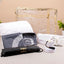 Safar-e-Imaan Men's Set - Umrah Hajj essentials set with Ihram towel, belt, sling bag, tasbeeh, and travel janamaz in a transparent gold-trimmed case.