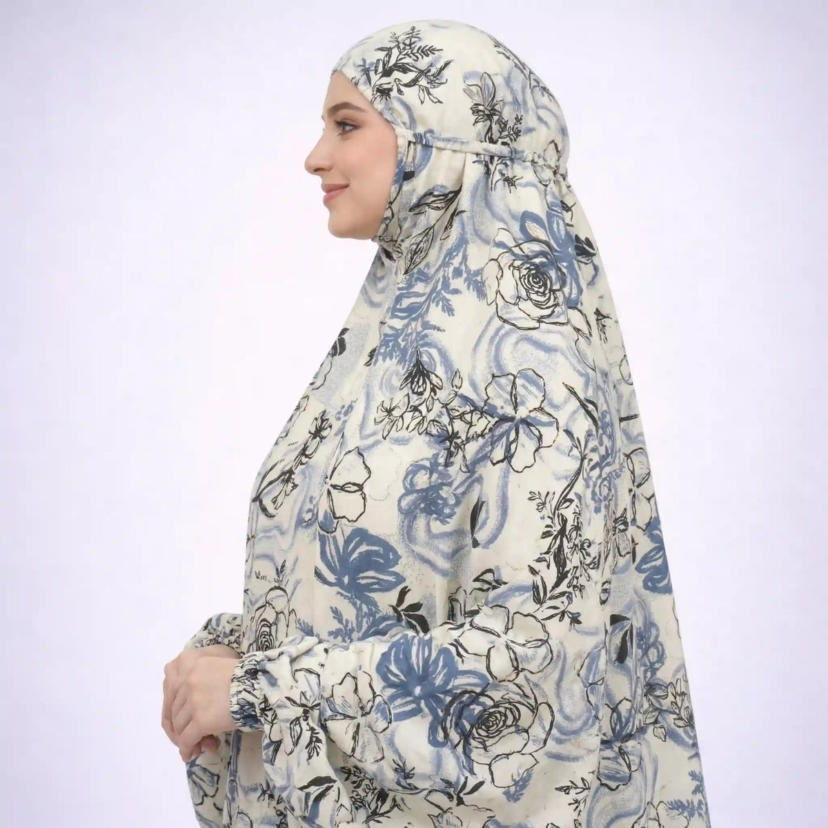 Side profile of floral cotton prayer dress with head covering