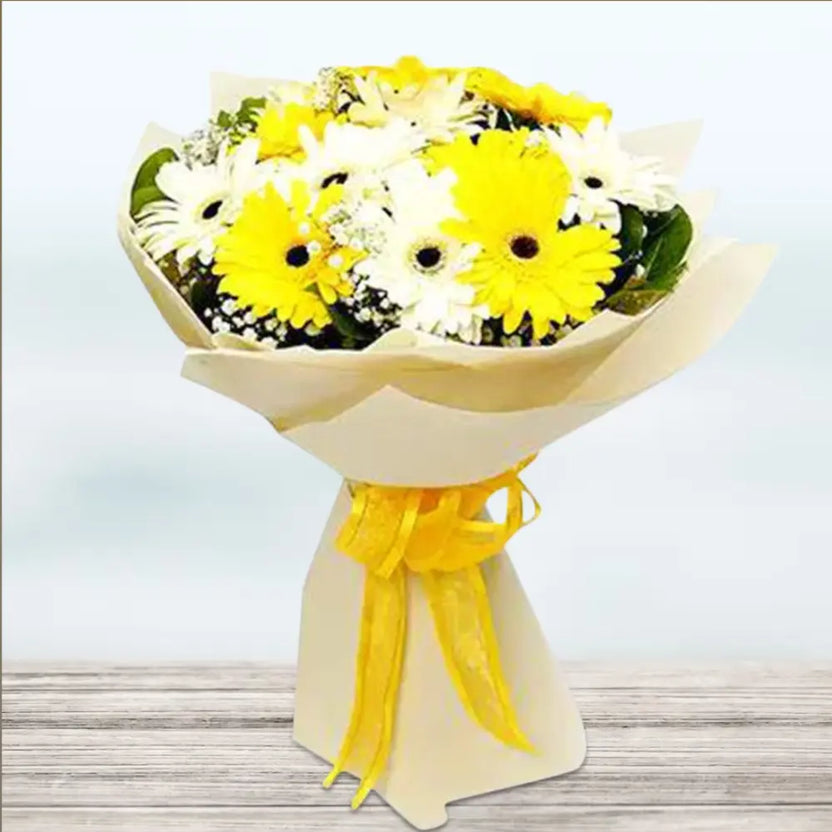 Mix Gerbera Flowers Bouquet with 10 stems featuring 5 yellow and 5 white Gerberas, wrapped in cream paper with yellow ribbon. Ideal for gift giving. Main image