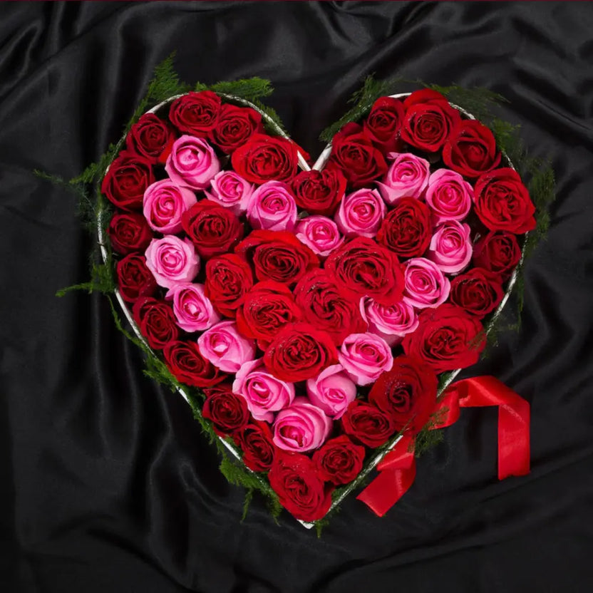 Serene Heart Mix Roses - Pink White Bouquet arranged in a heart shape with red and pink roses on black satin, ideal for romantic gift giving. Main image