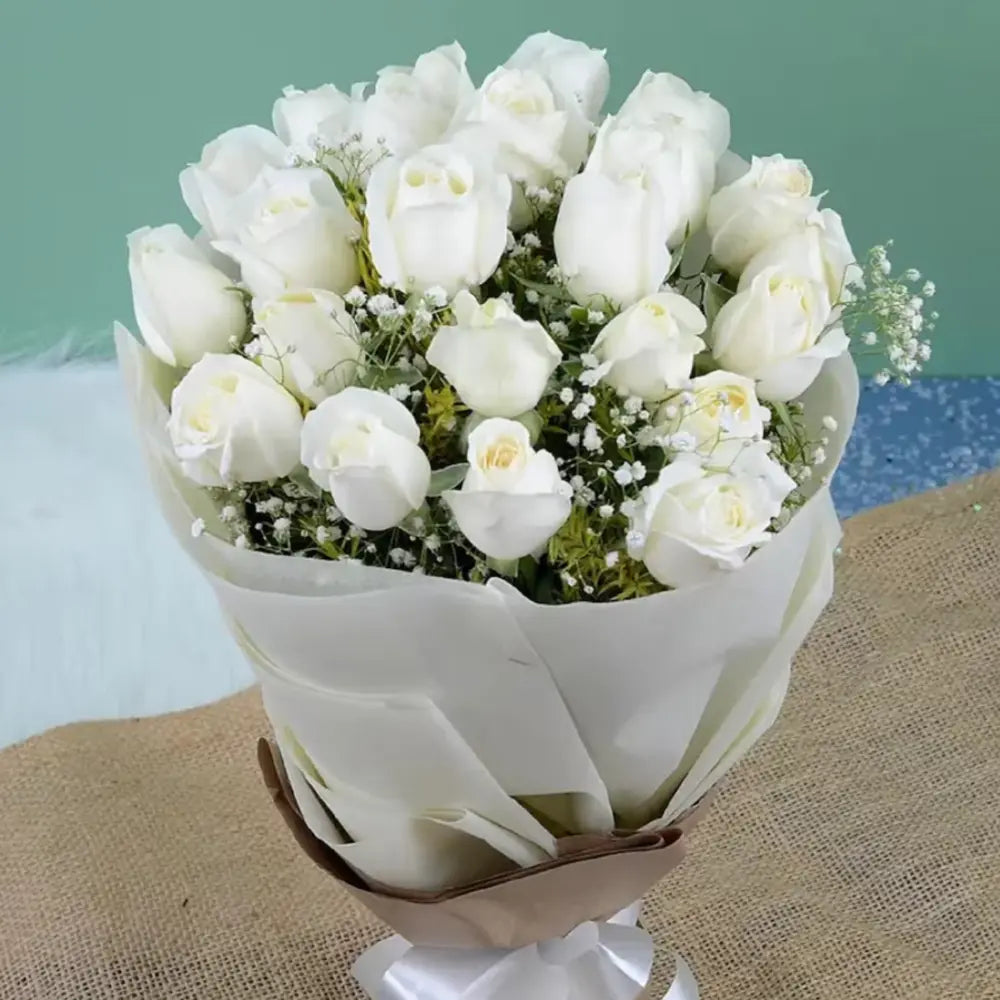 White Roses Bouquet - Good Luck Gifts | Fresh Blooms featuring pristine white roses wrapped in elegant white paper, ideal for celebrations and milestones. Main image