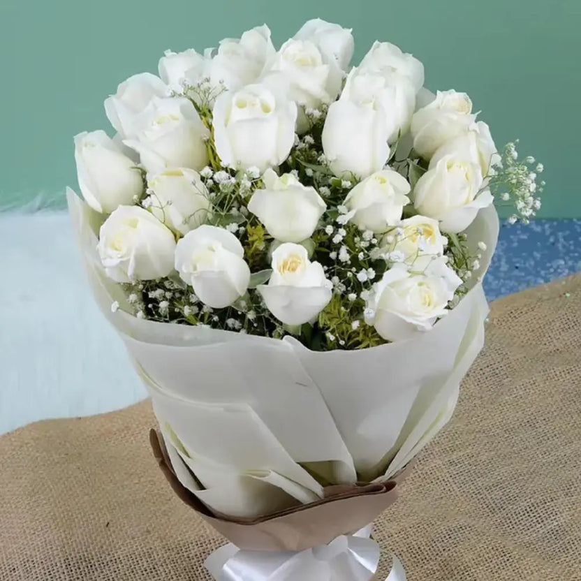 White Roses Bouquet - Good Luck Gifts | Fresh Blooms featuring pristine white roses wrapped in elegant white paper, ideal for celebrations and milestones. Main image