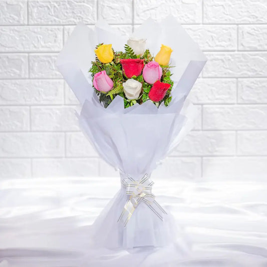 Elegant Mix Roses Bouquet featuring red, pink, yellow, and white roses wrapped in white paper. Ideal for anniversaries and vibrant gifting.