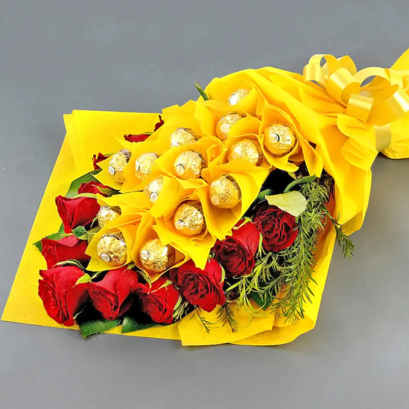 Chocolate Bouquet Gift - Happiness Chocolates wrapped in yellow paper with red roses and Ferrero Rocher, ideal for anniversaries or Women's Day. Main image