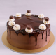 Exotic Chocolate Truffle Cake with glossy dark chocolate glaze, topped with whipped cream swirls and truffle pieces. Ideal for birthdays and anniversaries.