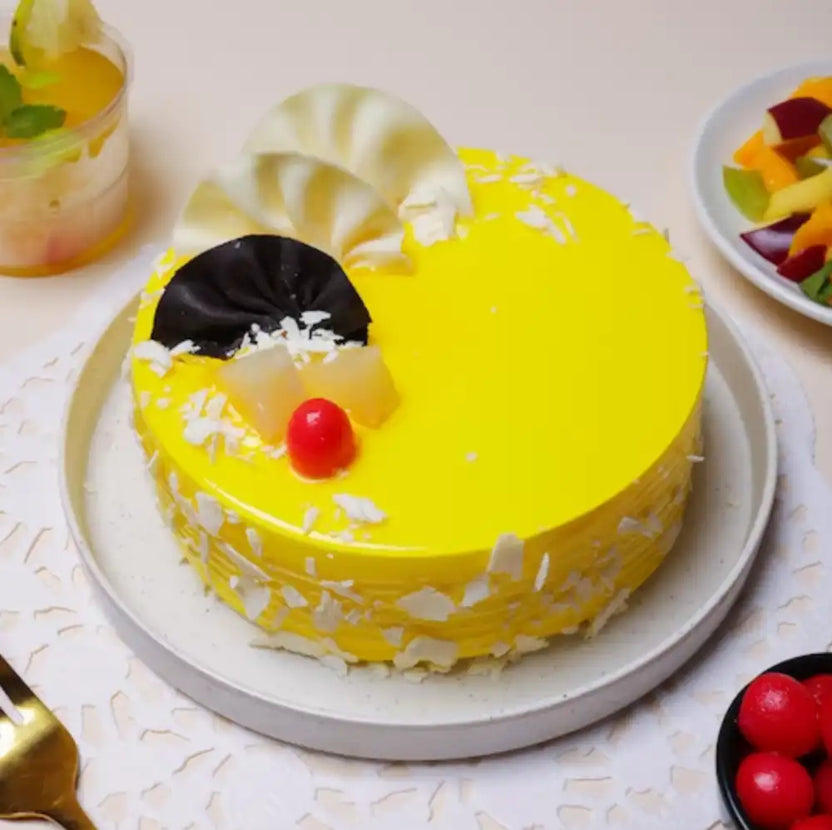 Yellow cake with decorative elements on a white plate Main image