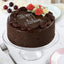 Delightful Chocolate Cake - Decadent Chocolate Cake with rich, moist layers, topped with floral icing and 'Happy Birthday' message, perfect for celebrations.