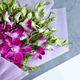 Heart Winning Orchids Bouquet arranged in packaging, close-up