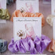 Purple satin scrunchie card favor with custom bridal shower design, ideal for nikah and wedding ceremony gift sets.