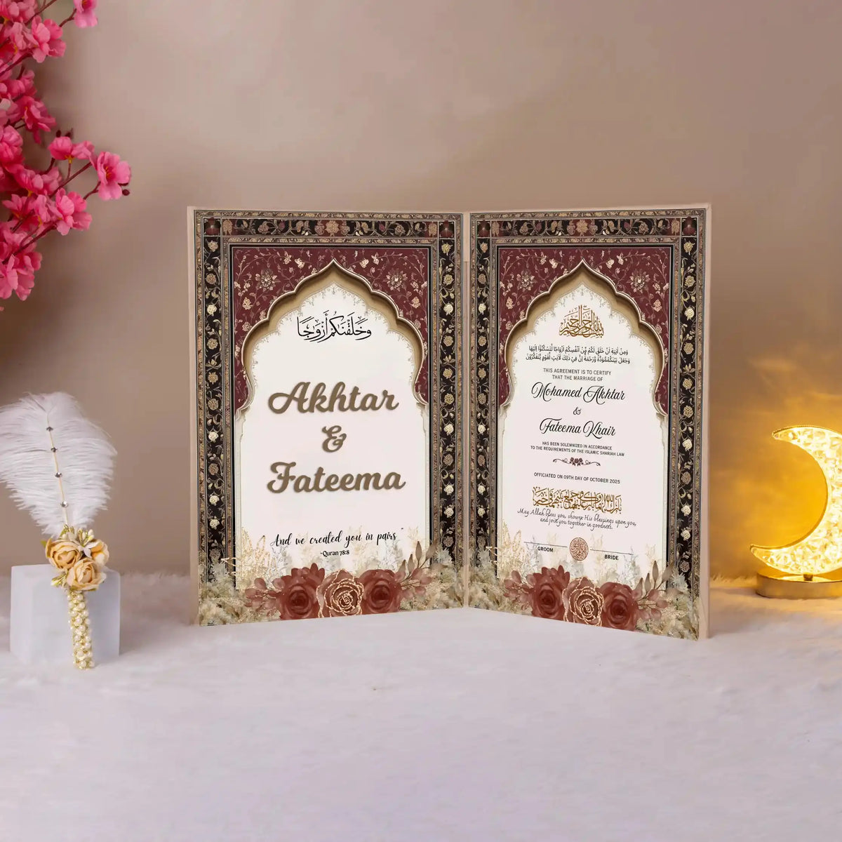 Elegant Shah-e-Surkh Nikah Nama booklet open to reveal personalized wedding details in a luxurious maroon and gold ceremonial design.