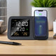 Shimmer Wireless Charger with Clock displays time, date, temperature, and charges a smartphone on a modern desk setup. Ideal for nightstands or offices.