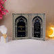 Elegant Siyah-e-Wafa Nikah Nama booklet opened to display intricate Islamic patterns and personalized wedding details in black and gold.