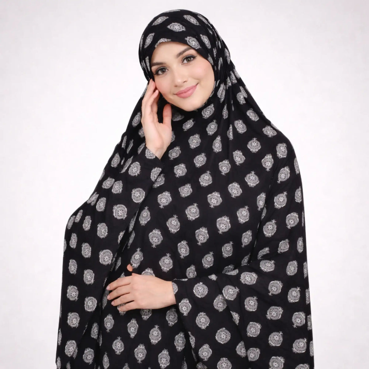 Siyah Al Noor knee length printed cotton Namaz Makhna in black with white floral motifs, ideal modest prayer dress for salah, hajj, and umrah.