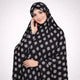 Siyah Al Noor knee length printed cotton Namaz Makhna in black with white floral motifs, ideal modest prayer dress for salah, hajj, and umrah.