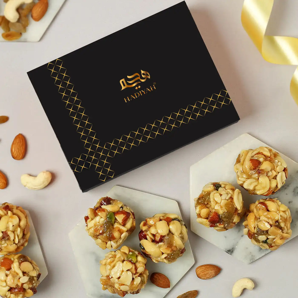 Special Dry Fruit Laddo gift box with premium nuts and dried fruits, ideal for Eid and festive celebrations. Elegant black packaging with golden accents.