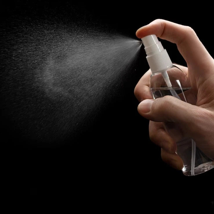 Travel Spray Bottle - Pack of 2 - Essential for Travel, demonstrated in use with fine mist spray, perfect for zamzam or rose water during pilgrimage.