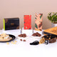 Khushi Aur Mithaas Ka Tohfa festive hamper with Kaju Katli, choco almonds, artisanal chocolate bars, and tasbeeh. A gourmet gift for joyful moments.