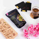 California Pistachio Crunch snack with premium tea sachets and floral decor, part of the Tea Gift Hamper Delight - Savor & Sip collection.