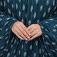 Close-up of gathered sleeves on teal printed cotton prayer dress, showcasing soft fabric and detailed feather pattern for modest fashion.
