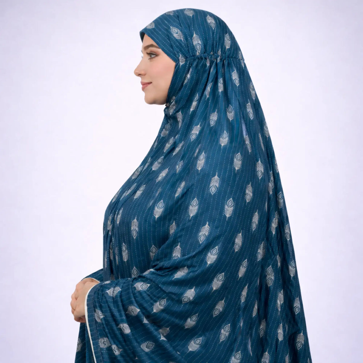 Side view of teal knee-length soft cotton prayer dress featuring modest full coverage and elegant feather print, perfect for religious use.