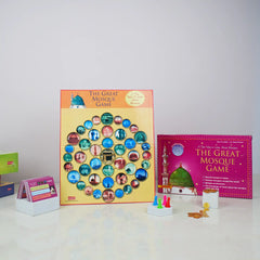 Board game set with colorful tiles and game pieces on a white surface.