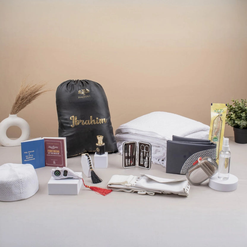 Raah-e-Makkah Safar Essentials - Luxury Hajj Umrah Hampers for men featuring ihram, prayer mat, grooming kit, and travel accessories in a gift set. Main image