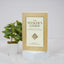 Book titled 'The Seeker's Guide' with a plant on a light background
