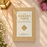 The Seeker's Guide - Pocket Edition by Maulana Wahiduddin Khan, a compact educational board book for kids aged 0-5, placed on a wooden table.