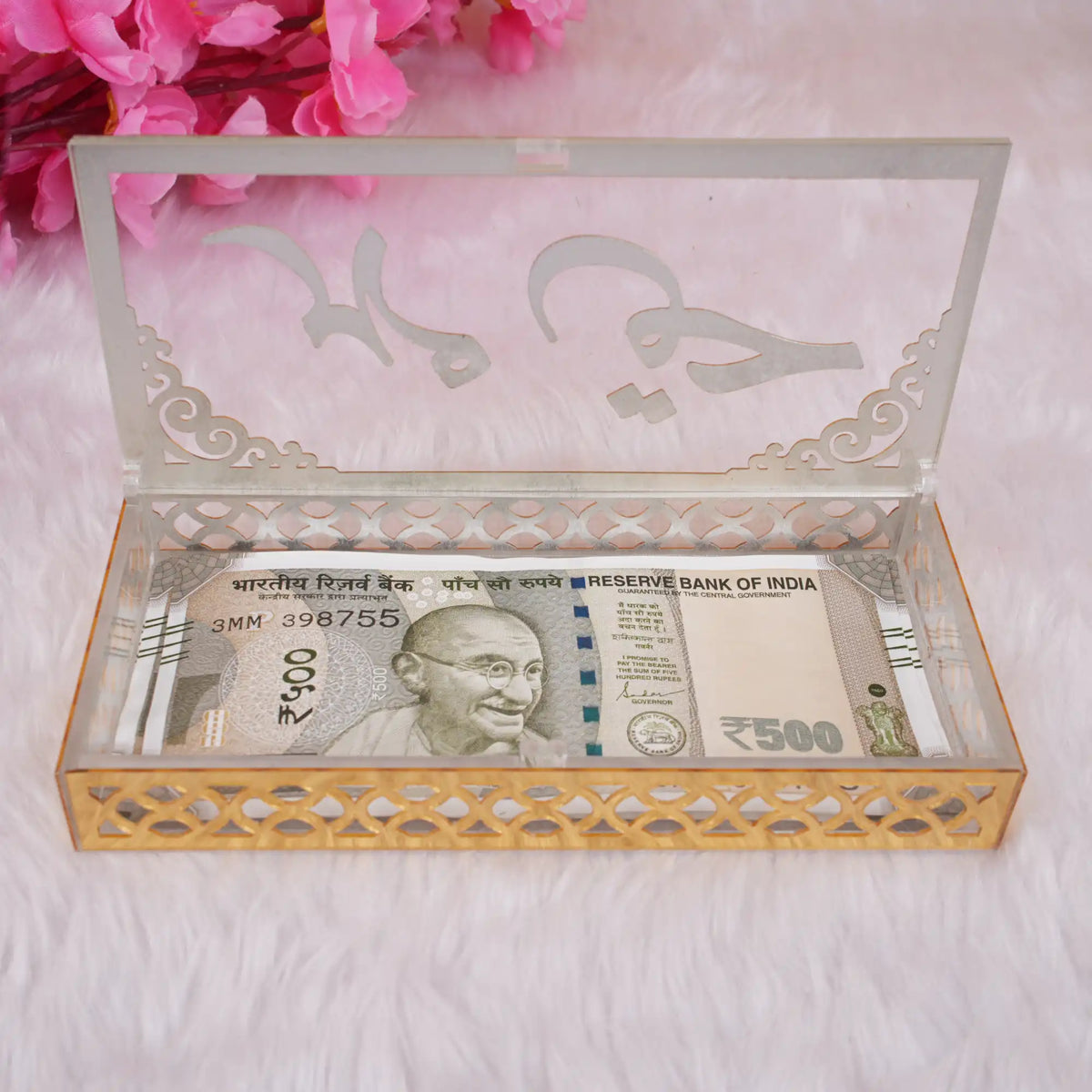 Transparent acrylic Haqq Mehr envelope with 500 INR note inside, showcasing intricate gold border. Ideal for Nikah and wedding gifting.