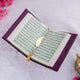 Open Quran with green Arabic script and gold feather bookmark. A spiritual gift from the Purple Sequence Rehal Hamper collection.