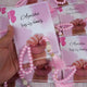 Close-up of pink Little Hands Tasbeeh Keepsake with name 'Ayesha' held in hand, a memorable Aqiqah wedding favor.