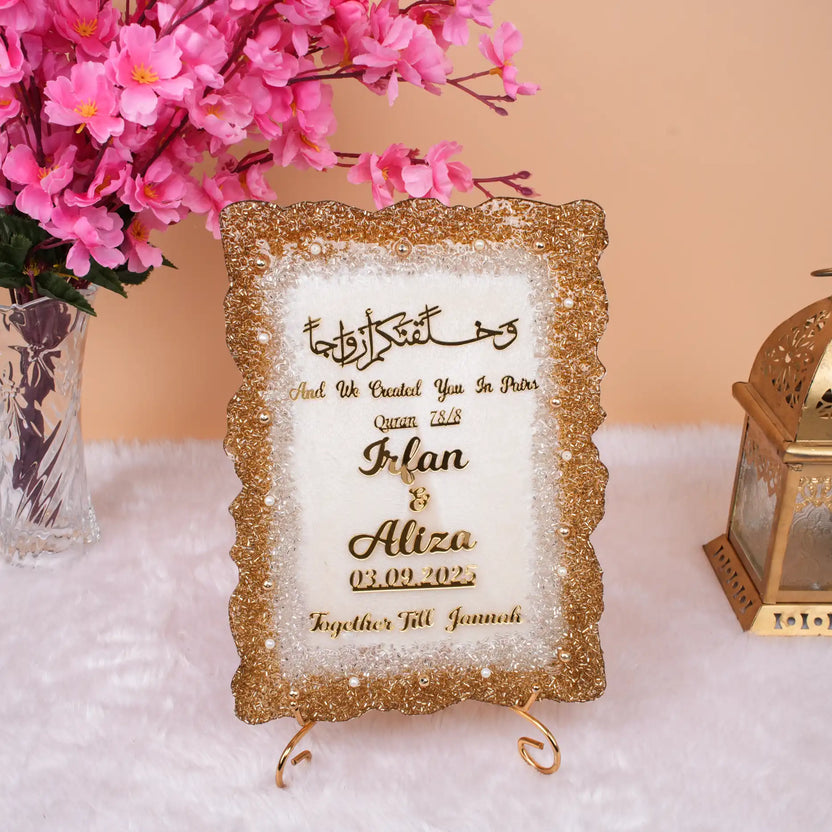 Offwhite Sequence Couple Frame (12x9 inches) with gold glitter border, personalized with names Irfan & Aliza. Ideal Islamic wedding gift frame. Main image