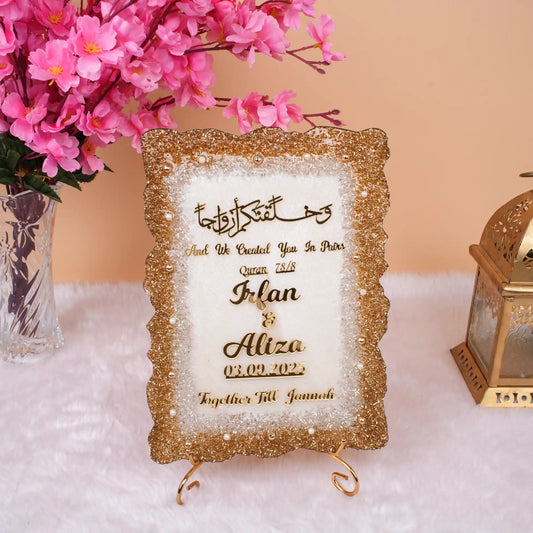 Offwhite Sequence Couple Frame (12x9 inches) with gold glitter border, personalized with names Irfan & Aliza. Ideal Islamic wedding gift frame.