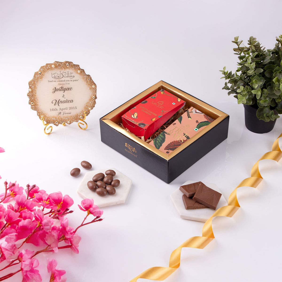 Premium Sweet Moments Gift Hamper in a black box with gourmet chocolates and custom plaque, ideal for festive gifting and special occasions.